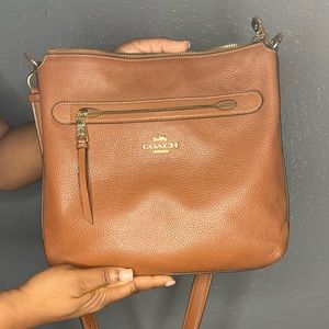 Tan Coach bag/purse.